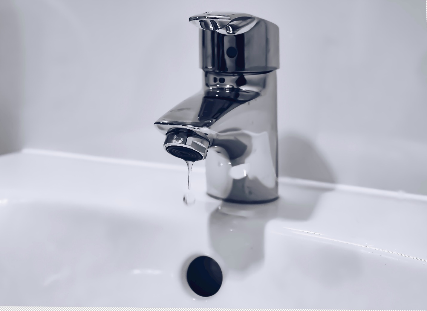 Water dripping from a tap.